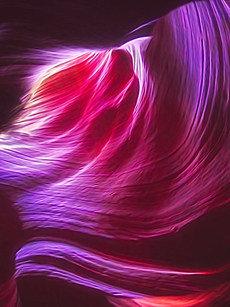 Abstract image of vibrant flowing light trails in dynamic motion.